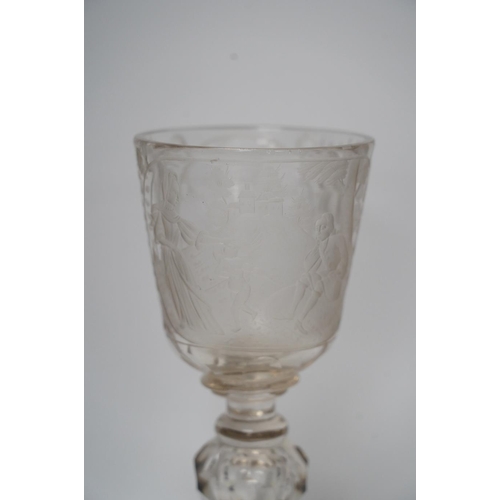 268 - A Victorian engraved tall stemmed wine glass with white metal mounted foot rim, 22cm high. Condition... 