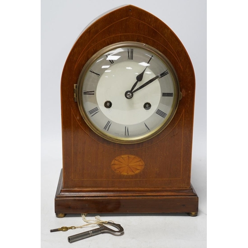 273 - An Edwardian inlaid mahogany eight day lancet topped mantel clock, with key, 31cm high. Condition - ... 