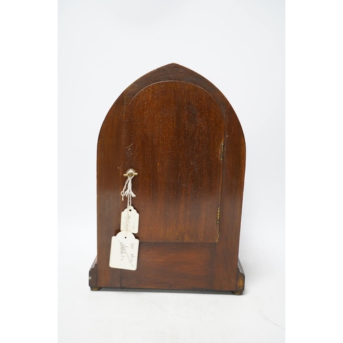 273 - An Edwardian inlaid mahogany eight day lancet topped mantel clock, with key, 31cm high. Condition - ... 