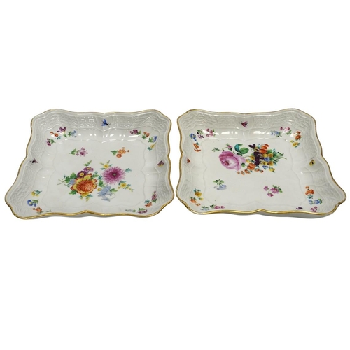 279 - A pair of Meissen square shaped dishes, painted with scattered floral sprigs. Condition - fair to go... 