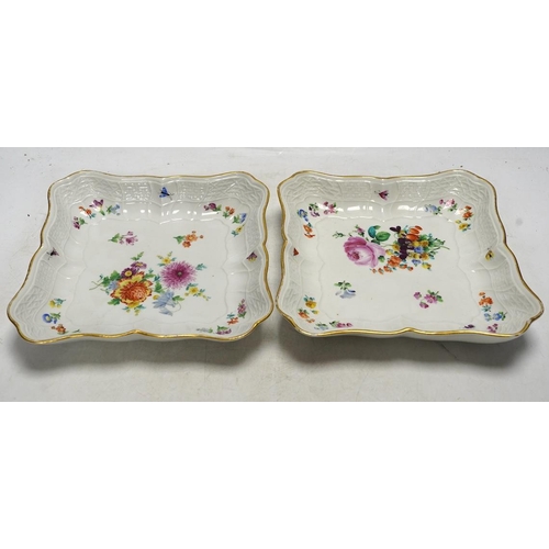 279 - A pair of Meissen square shaped dishes, painted with scattered floral sprigs. Condition - fair to go... 