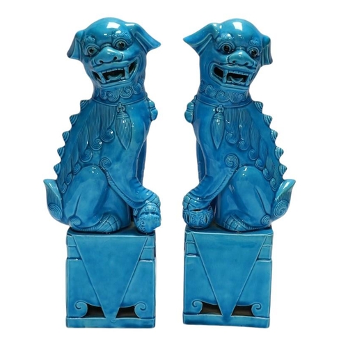 282 - A pair of Chinese turquoise glazed lion dogs, 29cm. Condition - good