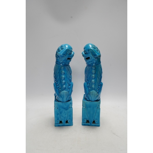 282 - A pair of Chinese turquoise glazed lion dogs, 29cm. Condition - good