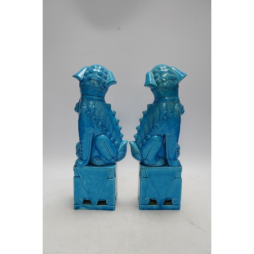 282 - A pair of Chinese turquoise glazed lion dogs, 29cm. Condition - good