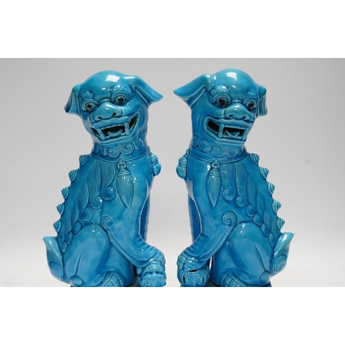 282 - A pair of Chinese turquoise glazed lion dogs, 29cm. Condition - good