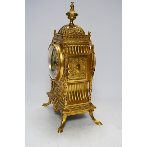 283 - An early 20th century French ormolu mantel clock with key and pendulum, 33cm. Condition - good, not ... 