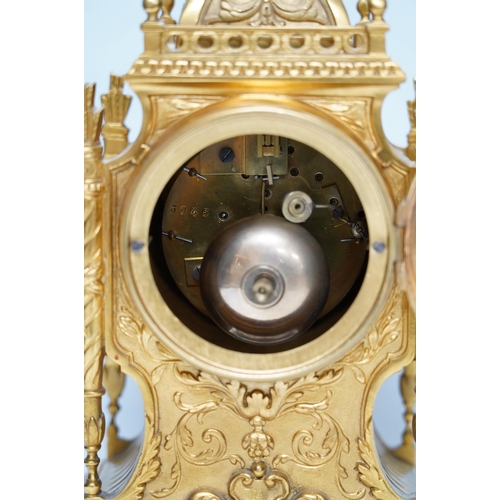 283 - An early 20th century French ormolu mantel clock with key and pendulum, 33cm. Condition - good, not ... 