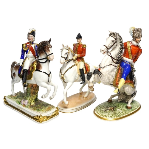 312 - A group of eight Italian porcelain figures on horseback, tallest 30cm. Condition - fair