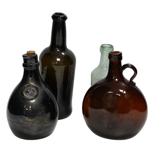 313 - A Georgian wine bottle and three others including one bearing label reading J.G. MONNET & Co. COGNA... 