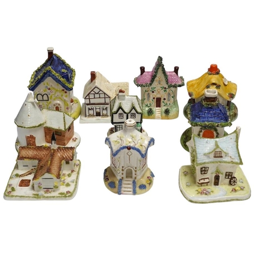 317 - Ten various ceramic model cottages. Condition - fair to good