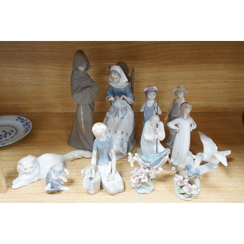 321 - Twelve various Lladro figures including birds and kittens, tallest 33cm. Condition - good