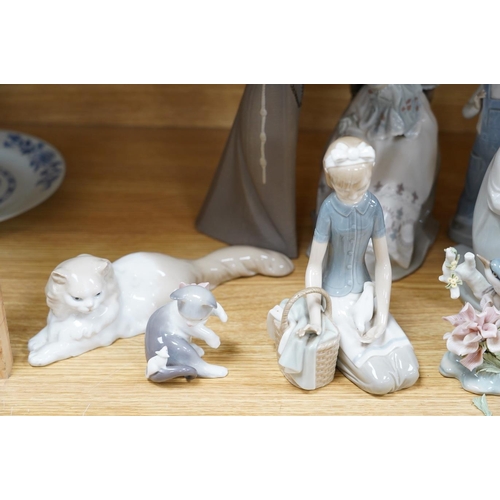 321 - Twelve various Lladro figures including birds and kittens, tallest 33cm. Condition - good