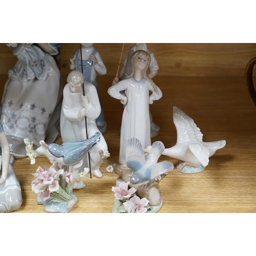 321 - Twelve various Lladro figures including birds and kittens, tallest 33cm. Condition - good