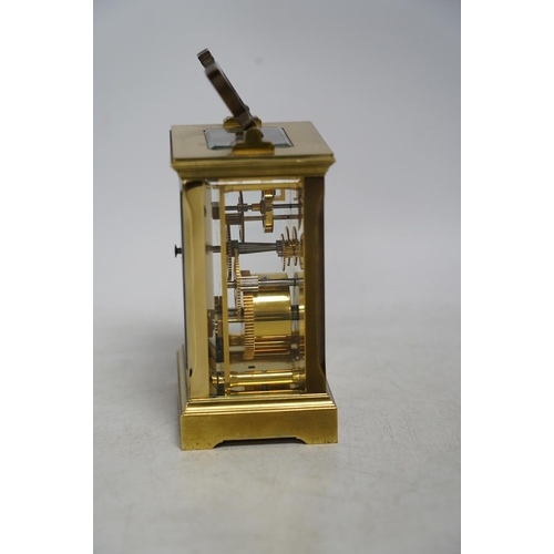 327 - A carriage timepiece with white enamelled Roman dial, in a gilt brass and glazed case, 13cm. Conditi... 