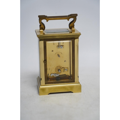 327 - A carriage timepiece with white enamelled Roman dial, in a gilt brass and glazed case, 13cm. Conditi... 