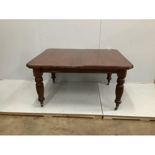 33 - A late Victorian walnut extending dining table, width 232cm extended, two spare leaves, depth 118cm,... 