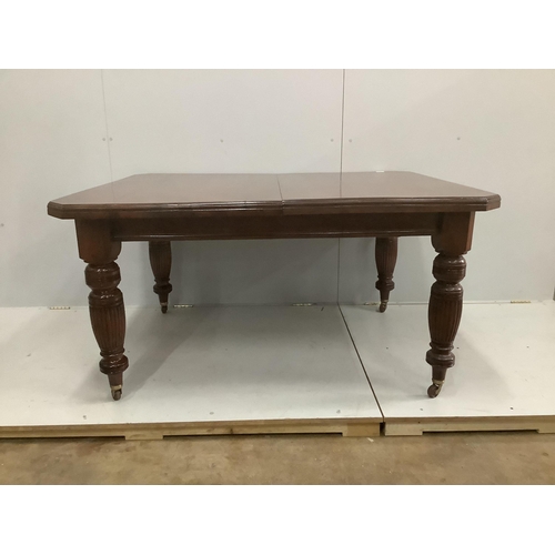 33 - A late Victorian walnut extending dining table, width 232cm extended, two spare leaves, depth 118cm,... 