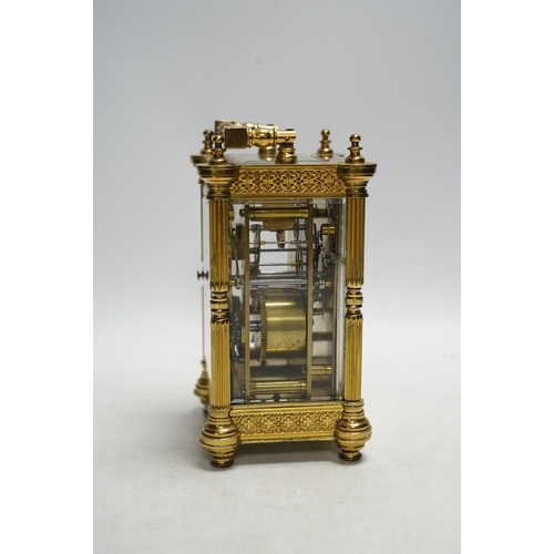 331 - A late 19th French pierced brass cased eight day carriage timepiece, with key, 17cm. Condition - sid... 