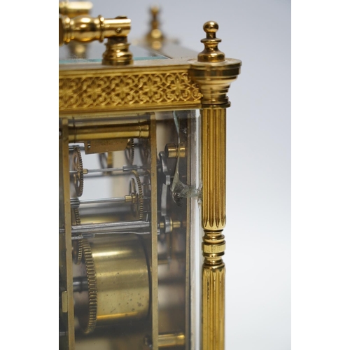 331 - A late 19th French pierced brass cased eight day carriage timepiece, with key, 17cm. Condition - sid... 