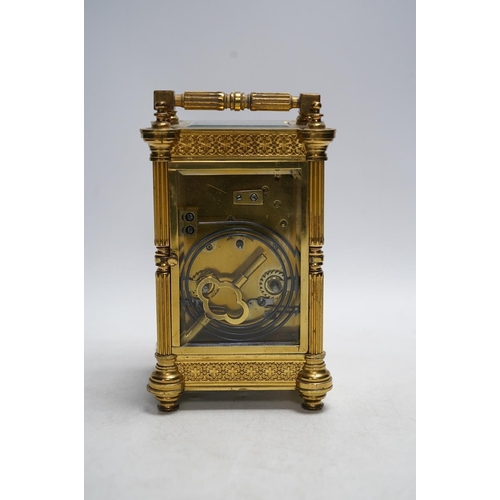 331 - A late 19th French pierced brass cased eight day carriage timepiece, with key, 17cm. Condition - sid... 