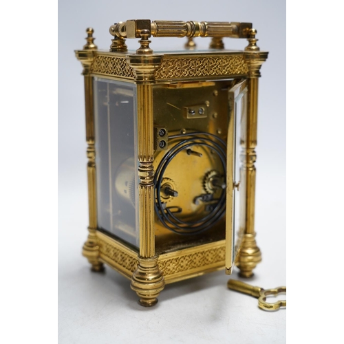 331 - A late 19th French pierced brass cased eight day carriage timepiece, with key, 17cm. Condition - sid... 