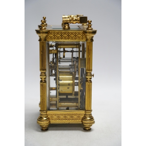 331 - A late 19th French pierced brass cased eight day carriage timepiece, with key, 17cm. Condition - sid... 