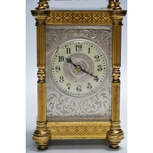 331 - A late 19th French pierced brass cased eight day carriage timepiece, with key, 17cm. Condition - sid... 