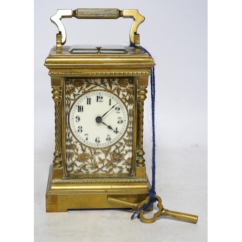 347 - A large brass repeating carriage clock with key and ornate filigree dial, 17cm high (including handl... 