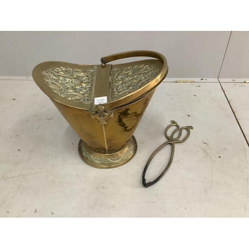 36 - A late Victorian embossed brass coal scuttle, height 43cm, and a pair of tongs. Condition - fair... 