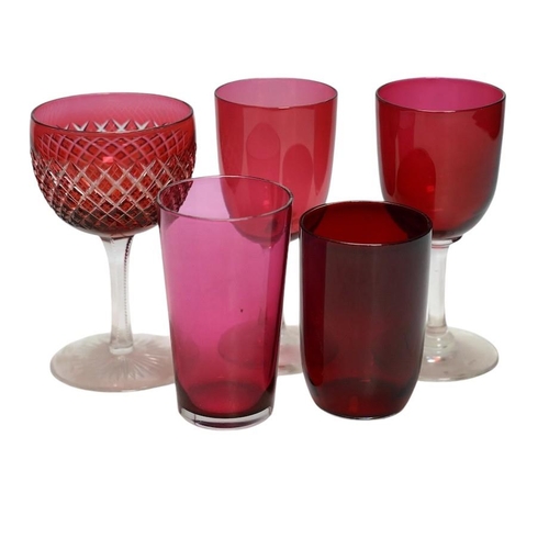 363 - A collection of Victorian cranberry glassware to include decanters, flashed glass goblets and vases,... 