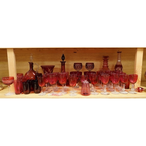 363 - A collection of Victorian cranberry glassware to include decanters, flashed glass goblets and vases,... 