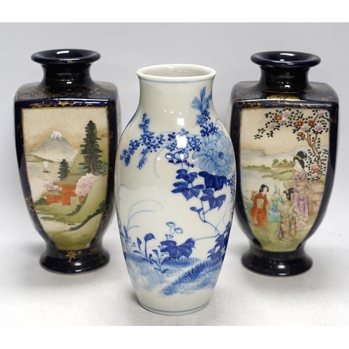 367 - A pair of Japanese satsuma pottery vases and a blue and white Meiji Arita vase, largest 24cm high. C... 