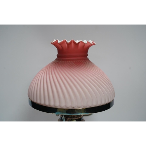 374 - A silver plated table lamp, with a pink satin glass wrythen fluted shade, 41cm high. Condition - sha... 