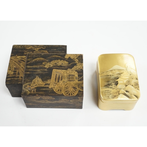 500 - Two Japanese lacquer boxes: one black with gilt decoration, the other gilt with a scene of Mount Fuj... 