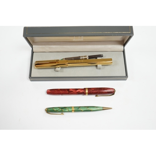 503 - A cased Dunhill gold plated fountain pen and two other pens, Dunhill pen 13.5cm long. Condition - fa... 