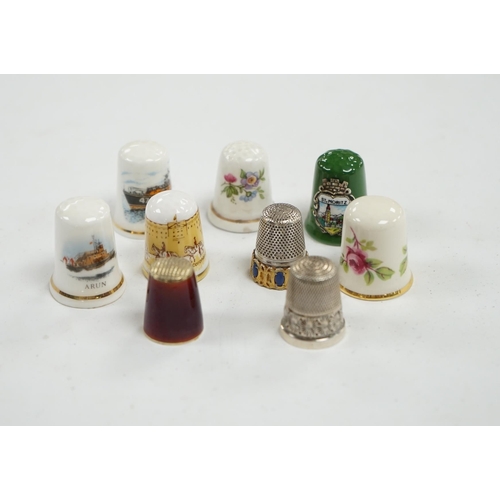 507 - A large collection of silver, nickel, brass and ceramic thimbles, and two thimble display perspex do... 