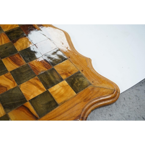 516 - A 19th century stained and natural bone chess set with board, 34cm x 34cm. Condition - fair, some da... 