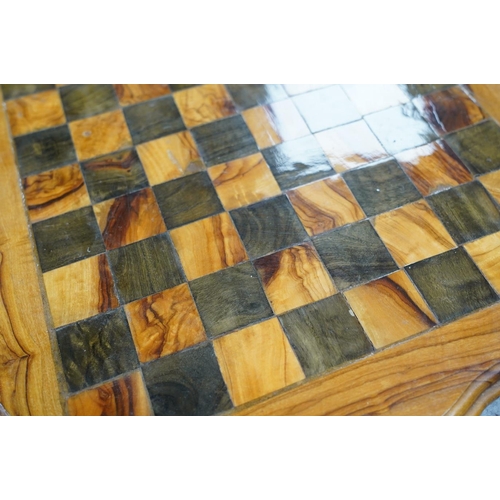 516 - A 19th century stained and natural bone chess set with board, 34cm x 34cm. Condition - fair, some da... 