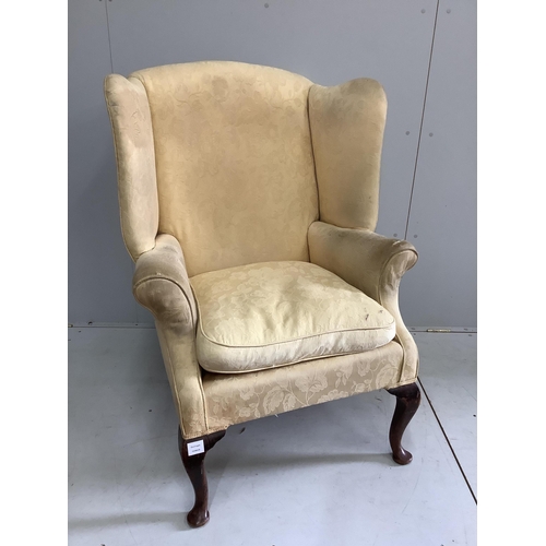 52 - A George III upholstered wing armchair, width 86cm, depth 74cm, height 105cm. Condition - poor to fa... 