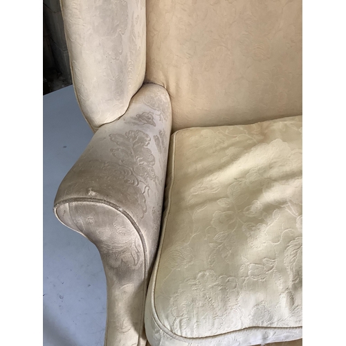 52 - A George III upholstered wing armchair, width 86cm, depth 74cm, height 105cm. Condition - poor to fa... 