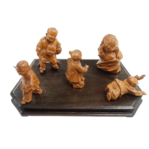 523 - A set five Chinese carved boxwood figures of children playing Blind mans Buff, Republic period, 23c... 