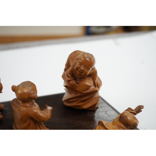 523 - A set five Chinese carved boxwood figures of children playing Blind mans Buff, Republic period, 23c... 