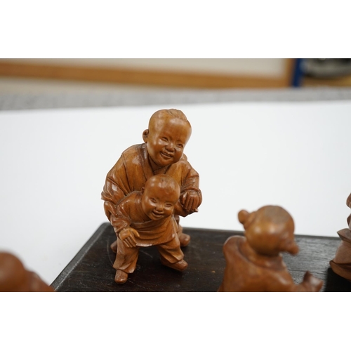 523 - A set five Chinese carved boxwood figures of children playing Blind mans Buff, Republic period, 23c... 