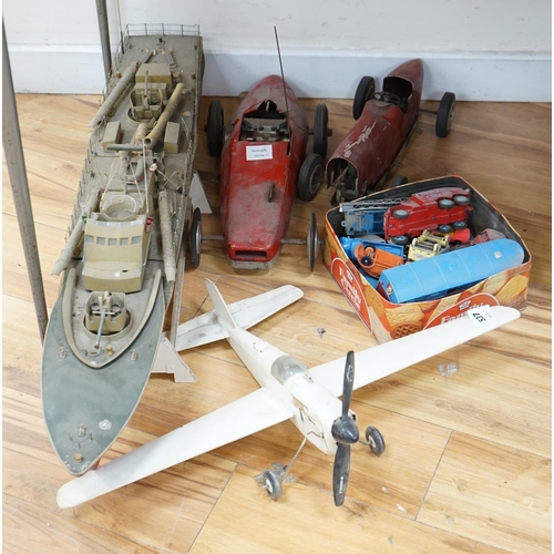 537 - Two tinplate model racing cars, a model aeroplane, battleship and other various cars. Condition - po... 