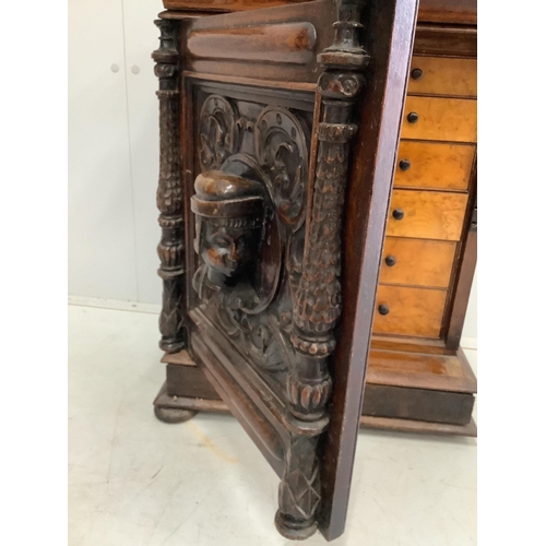 54 - A small Italian carved oak and walnut collector's chest, fitted ten bird's eye maple faced drawers, ... 