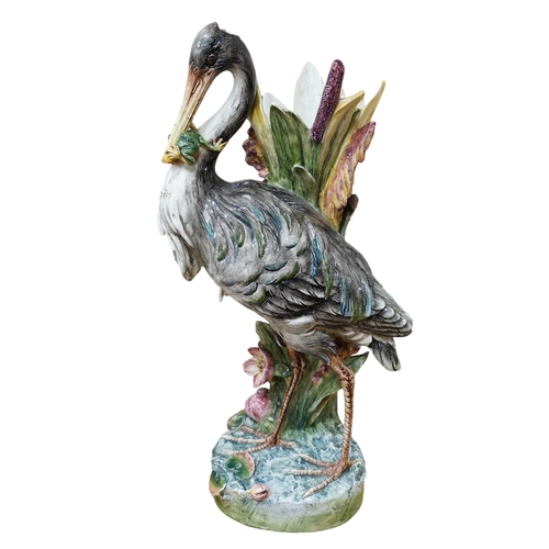 554 - A French decorative majolica 'Stork' stick stand, 100cm high. Condition - damage to head feathers... 