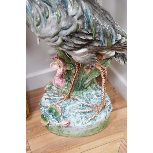 554 - A French decorative majolica 'Stork' stick stand, 100cm high. Condition - damage to head feathers... 