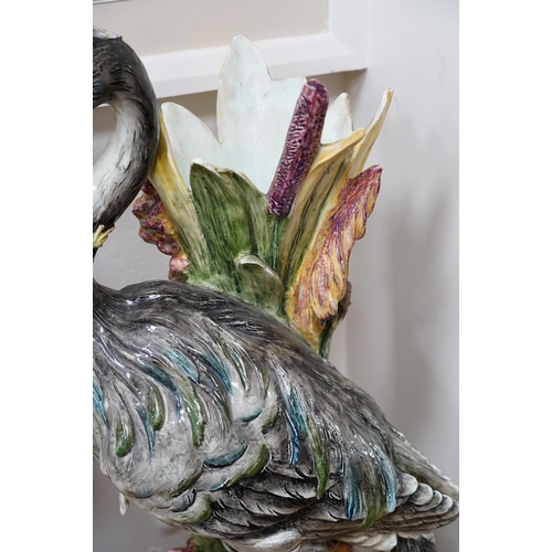 554 - A French decorative majolica 'Stork' stick stand, 100cm high. Condition - damage to head feathers... 