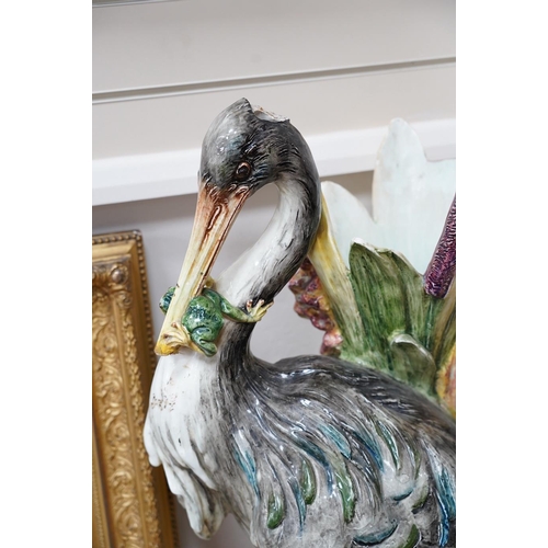 554 - A French decorative majolica 'Stork' stick stand, 100cm high. Condition - damage to head feathers... 