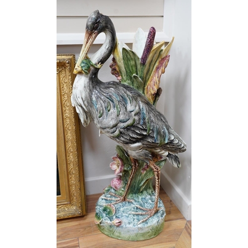 554 - A French decorative majolica 'Stork' stick stand, 100cm high. Condition - damage to head feathers... 